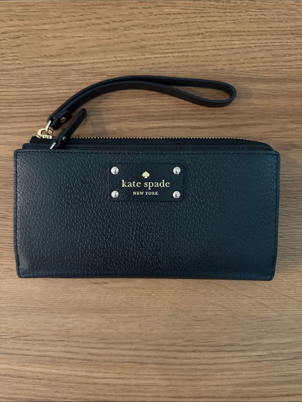 kate spade black leather wristlet clutch with gold logo plaque
